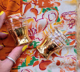 PAIR OF VINTAGE GOLD SHOT GLASSES